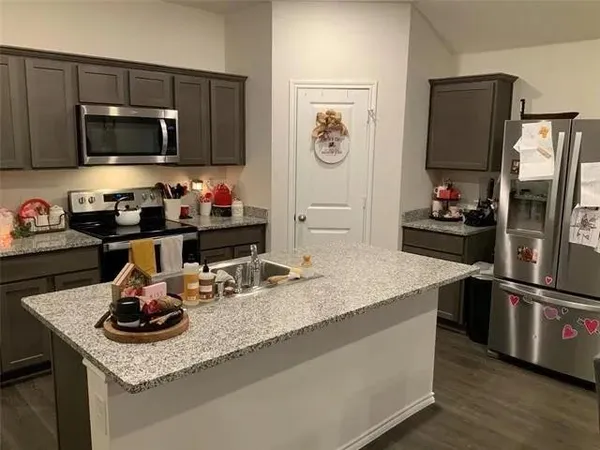 a bedroom with a bed and a chair