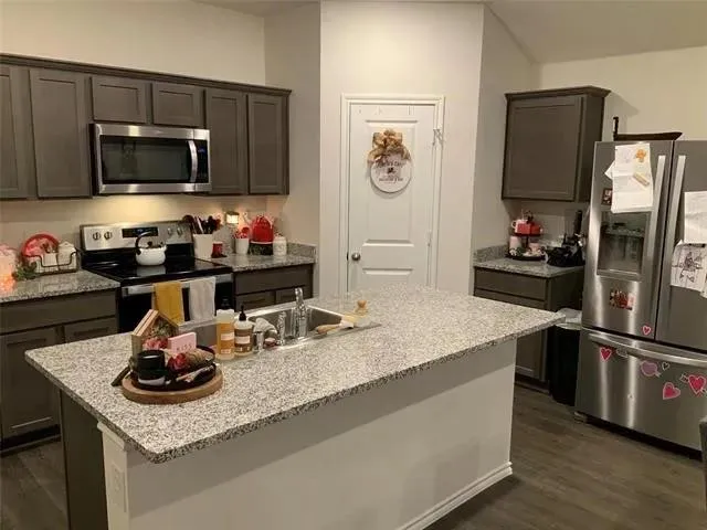 a bedroom with a bed and a chair