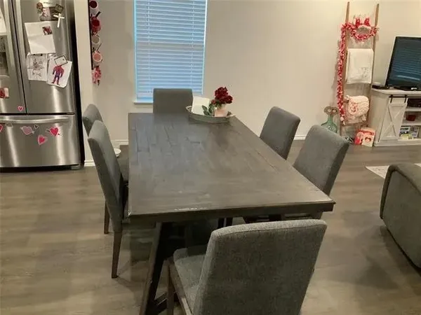 a kitchen with stainless steel appliances granite countertop a sink stove and microwave