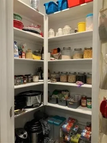 a bedroom with a bed and lamp