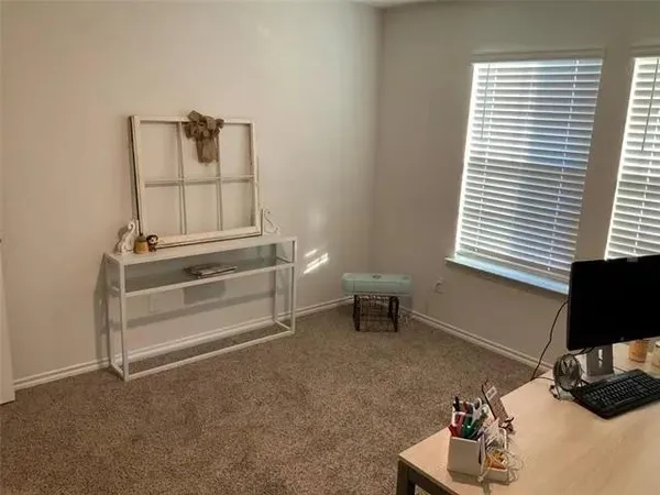 a room with a chair and a window