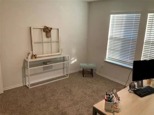 a room with a chair and a window