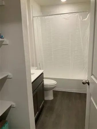 a view of a park with iron fence