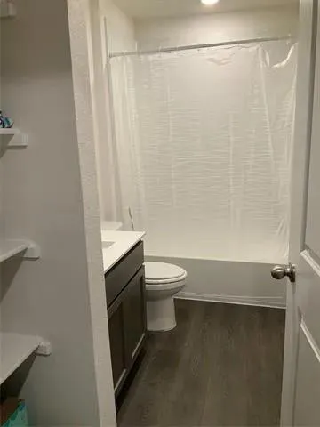 a view of a park with iron fence