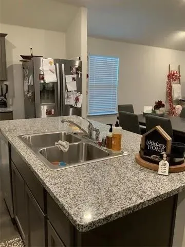 a view of a swimming pool with lawn chairs under an umbrella