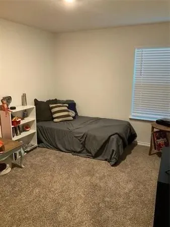 a kitchen with a sink and a refrigerator