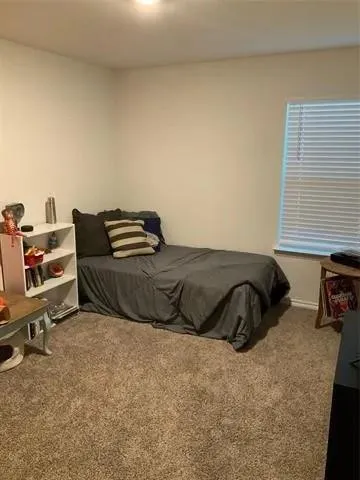 a kitchen with a sink and a refrigerator