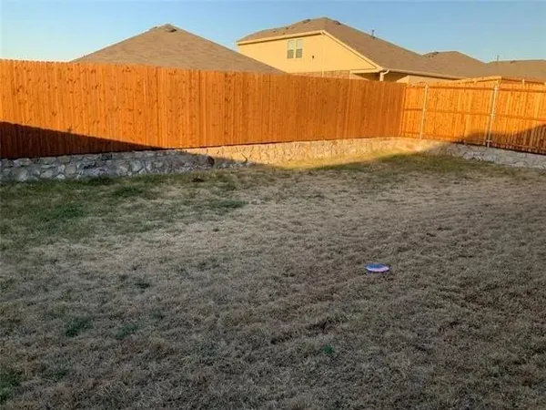 a bedroom with a bed and a chair