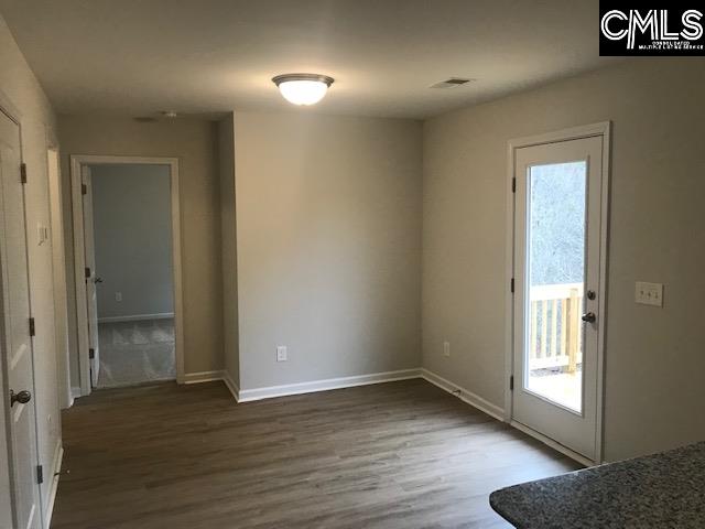 1069 Acacia Lane Columbia, SC 29229 - Photo 7 of 11 an empty room with wooden floor and windows