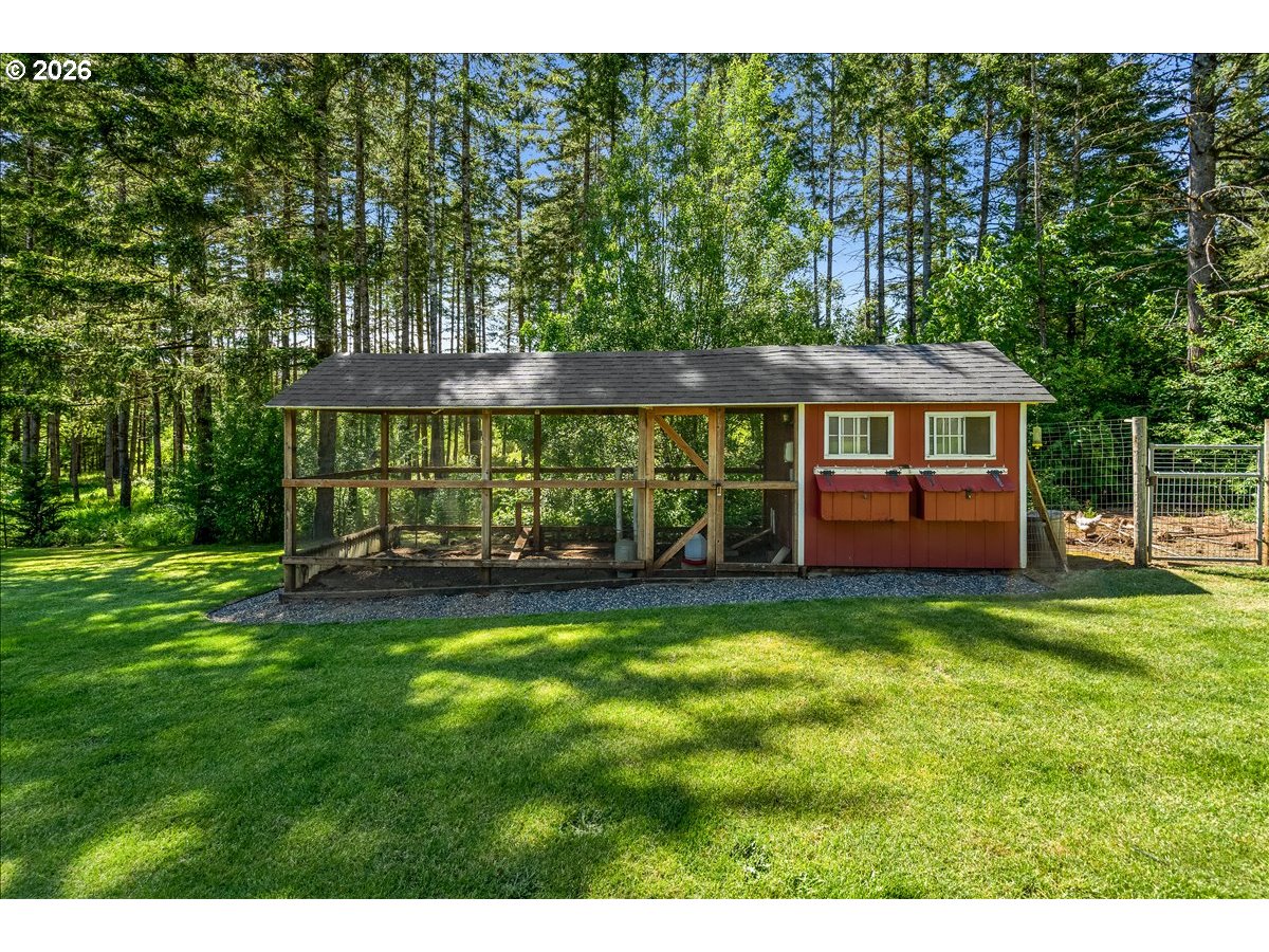 28311 Northwest Nowakowski Road Buxton, OR 97109 - Photo 44 of 48 a view of an house with backyard space and balcony
