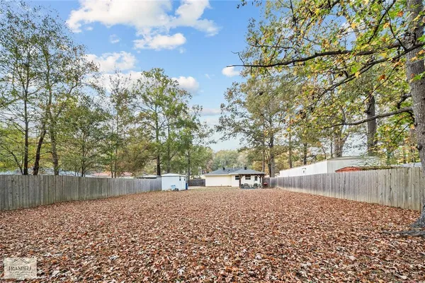 a view of outdoor space with deck and tree