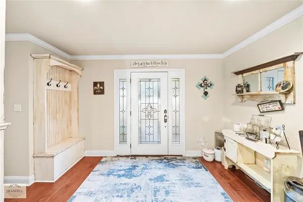 a view of a livingroom with wooden floor and a window