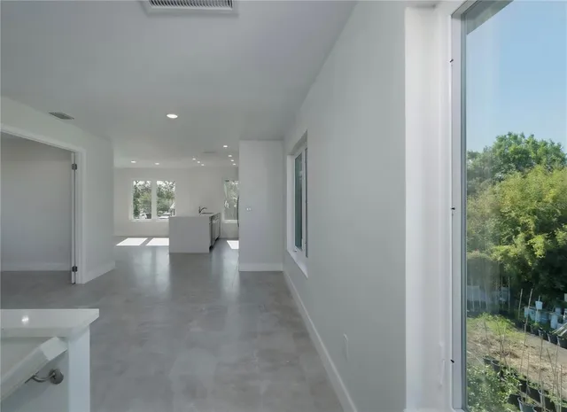 a bathroom with a toilet a sink a mirror and vanity