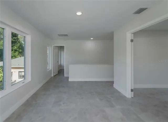 a bathroom with a shower and sink