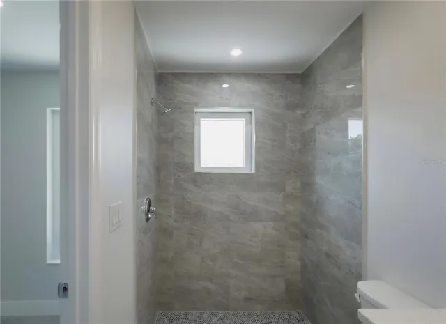 a view of staircase with white walls