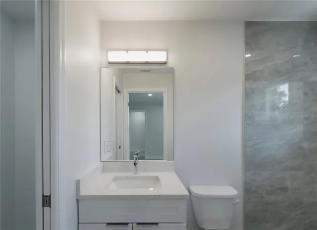 a front view of house with yard and trees