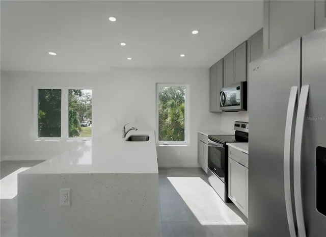 a view of an empty room with a window