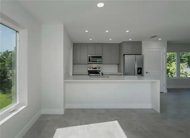 a bathroom with a toilet sink and shower