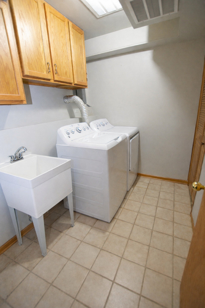 8313 Garrison Road Wonder Lake, IL 60097 - Photo 13 of 23 a utility room with a sink washer and dryer