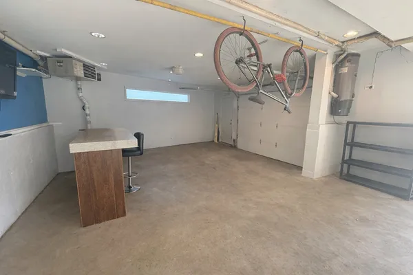 a view of a storage & utility room with racks on the wall