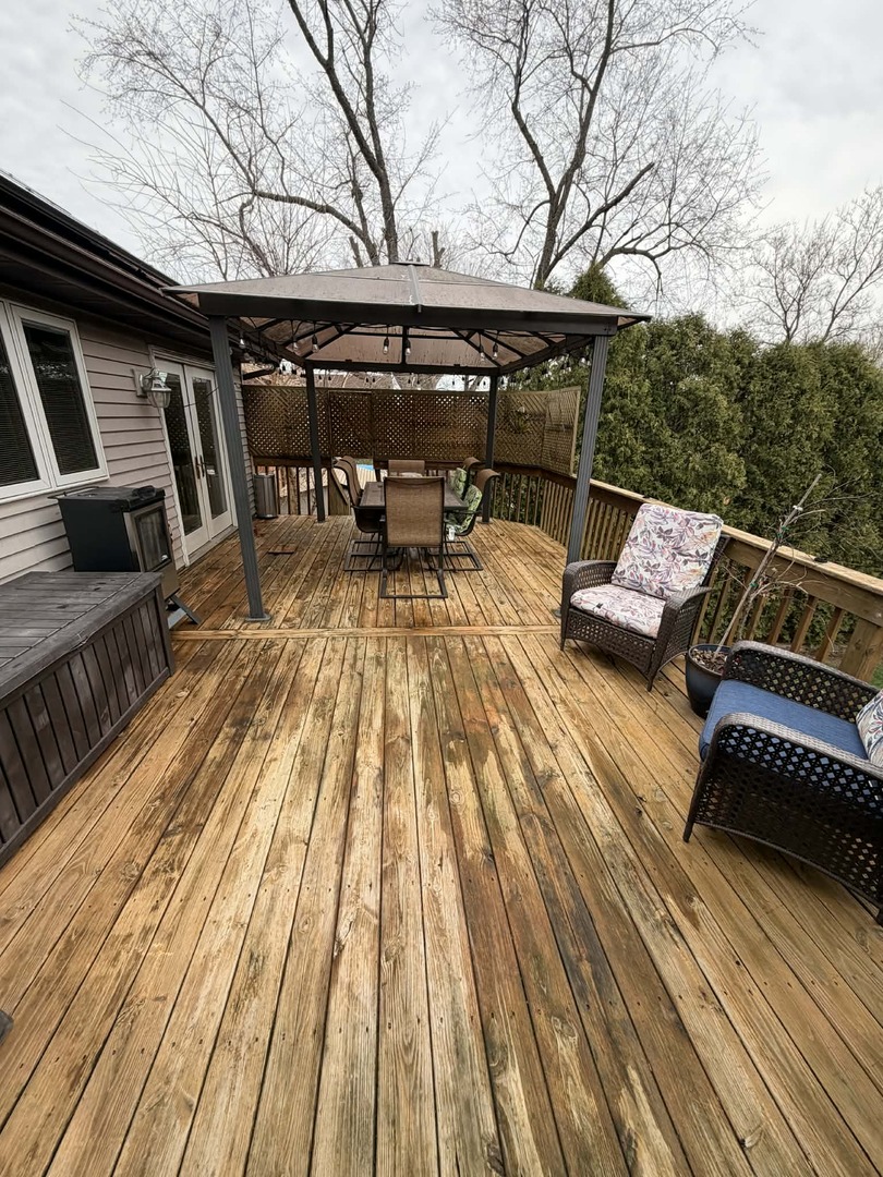 8313 Garrison Road Wonder Lake, IL 60097 - Photo 20 of 23 a view of sitting area with furniture and wooden floor