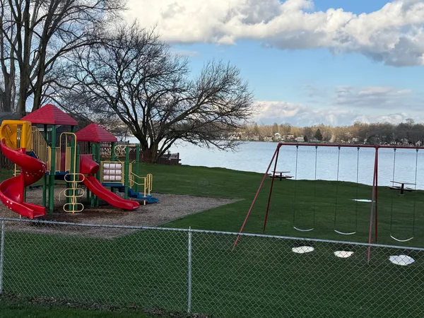 a view of a playground with basketball court