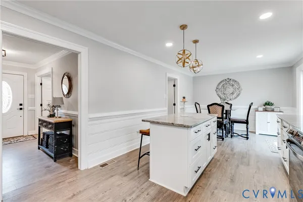 a view of living room filled with furniture and wooden floor