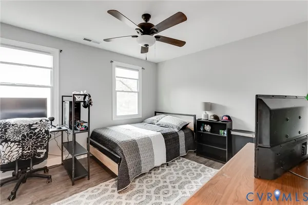 a bedroom that has a bed and a window