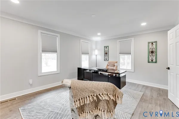 a bed room with a bed and a chair