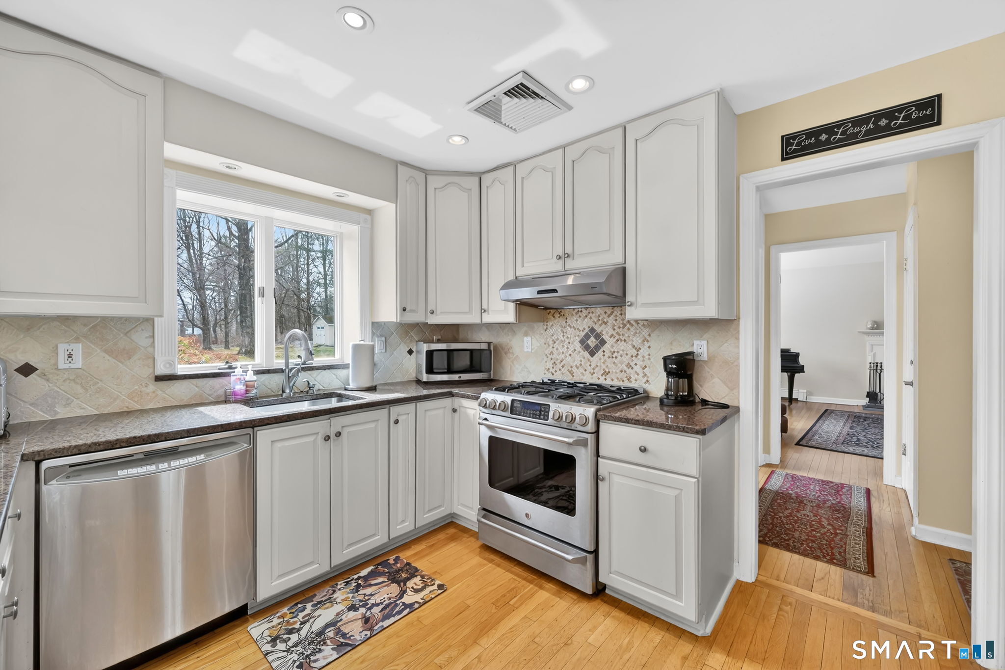 20 Kitcher Court Trumbull, CT 06611 - Photo 17 of 39 a kitchen with a stove a sink and a window