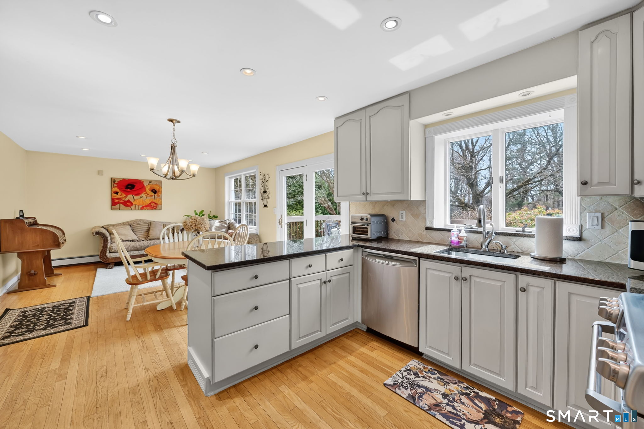 20 Kitcher Court Trumbull, CT 06611 - Photo 18 of 39 a kitchen with granite countertop a sink cabinets and window
