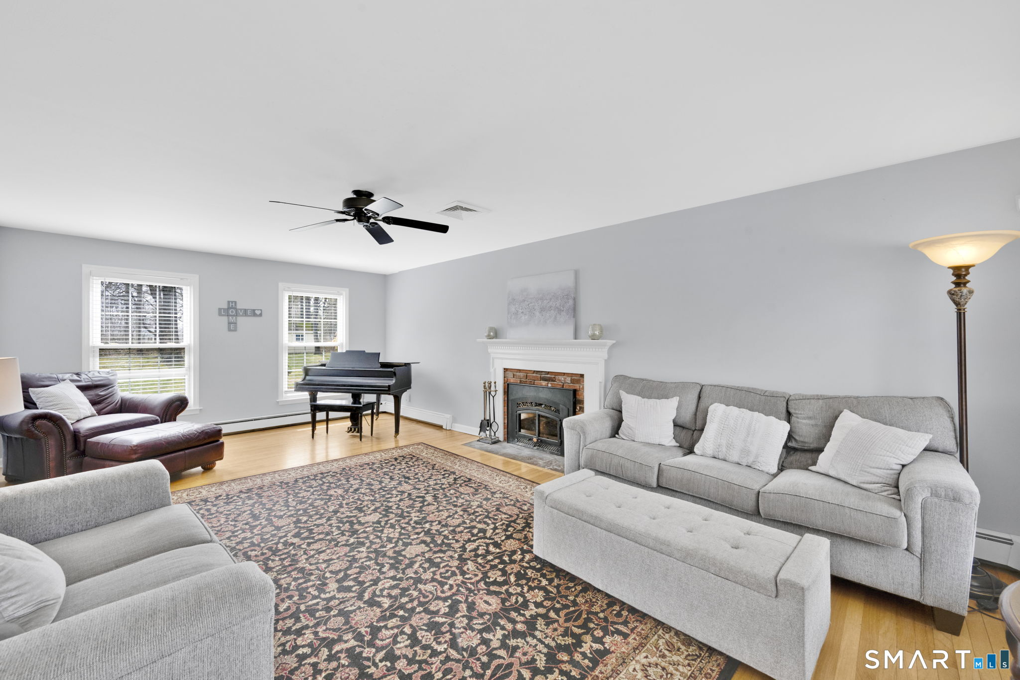 20 Kitcher Court Trumbull, CT 06611 - Photo 20 of 39 a living room with furniture and a fireplace