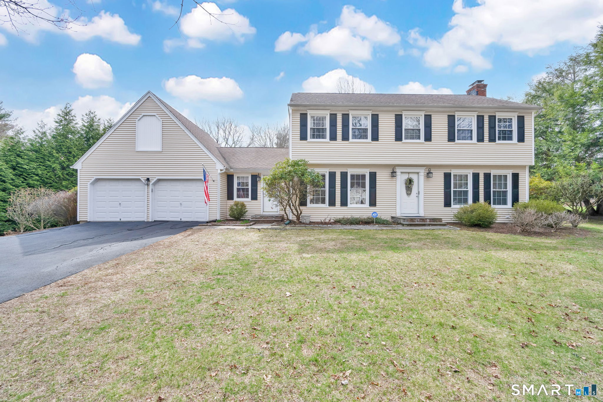 20 Kitcher Court Trumbull, CT 06611 - Photo 5 of 39 a front view of a house with a yard and garage