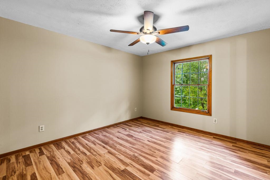 2005 Bennett Road St. Augustine, FL 32092 - Photo 24 of 95 an empty room with wooden floor fan and windows