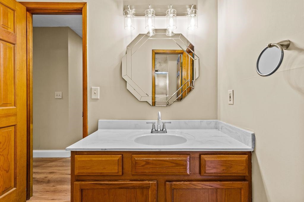 2005 Bennett Road St. Augustine, FL 32092 - Photo 26 of 95 a bathroom with a sink a mirror and shower