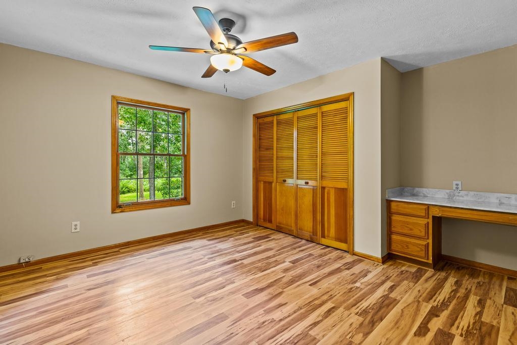 2005 Bennett Road St. Augustine, FL 32092 - Photo 28 of 95 a view of room with window a ceiling fan and wooden floor