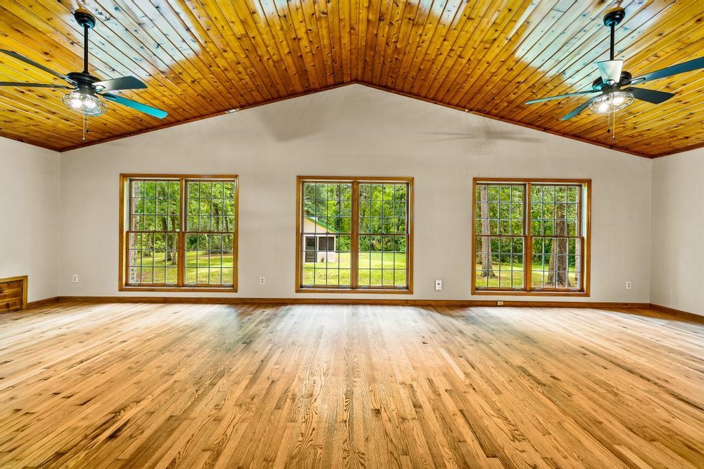 2005 Bennett Road St. Augustine, FL 32092 - Photo 30 of 95 a view of a big room with wooden floor and windows