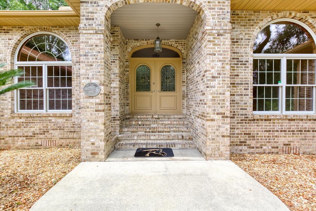 2005 Bennett Road St. Augustine, FL 32092 - Photo 4 of 95 a view of a brick house with a door and a window
