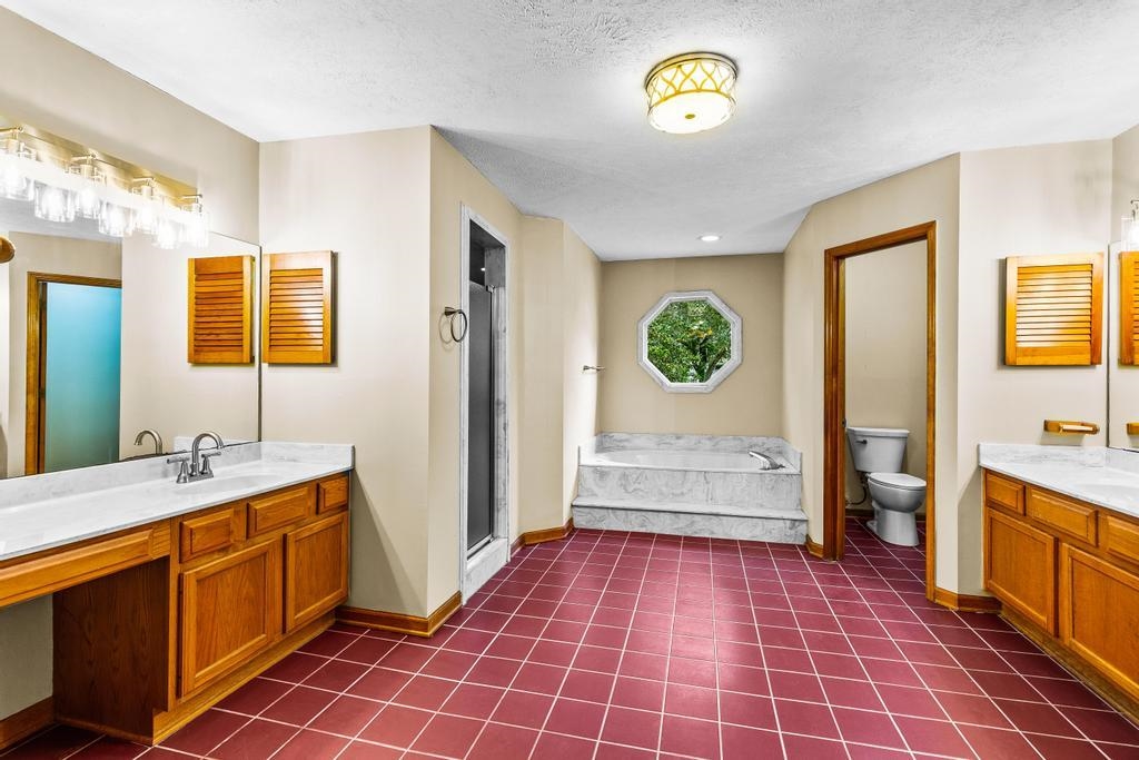 2005 Bennett Road St. Augustine, FL 32092 - Photo 45 of 95 a bathroom with a sink a mirror and a shower