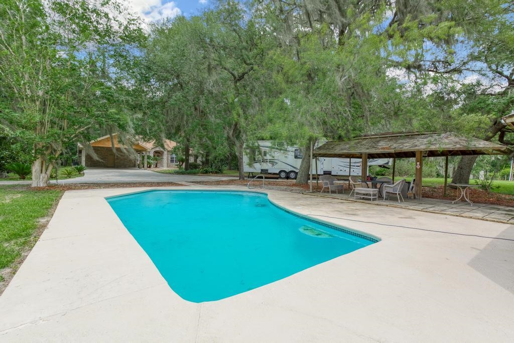 2005 Bennett Road St. Augustine, FL 32092 - Photo 61 of 95 a view of a swimming pool with chairs