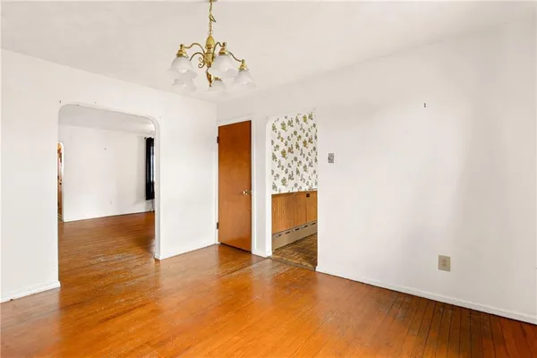 a view of a livingroom with wooden floor