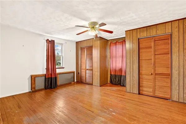 a bathroom with a sink a bathtub a mirror and a shower