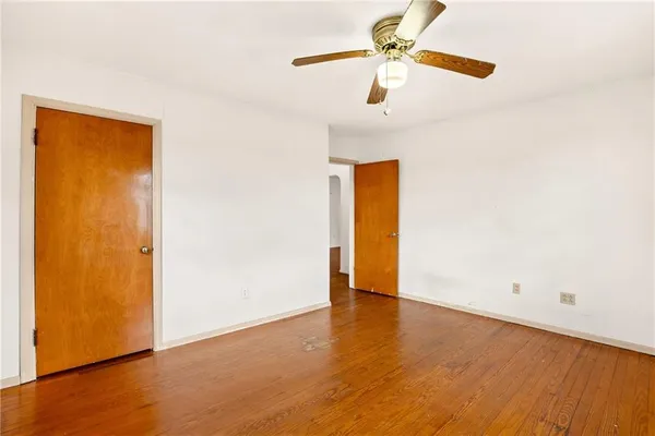 a view of a hallway with closet and stairs