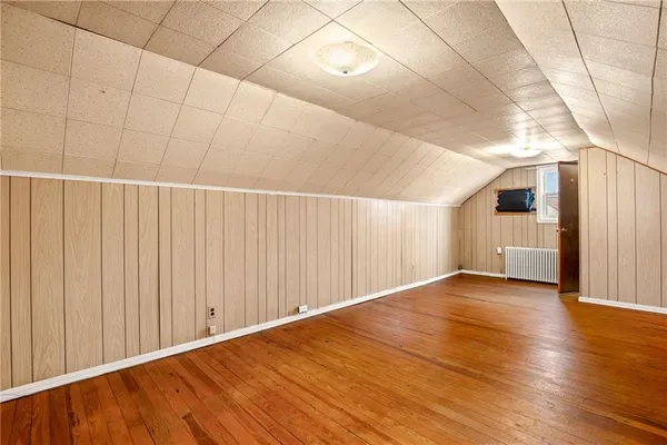 a bathroom with a toilet and a shower curtain