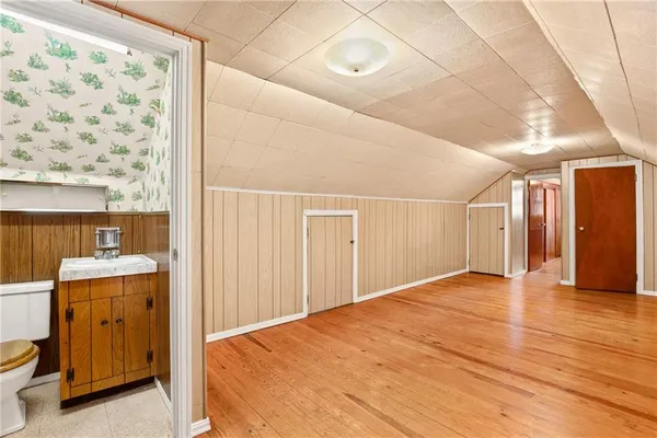 a view of an empty room with a fireplace