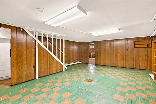 a view of a water heater room with a garage
