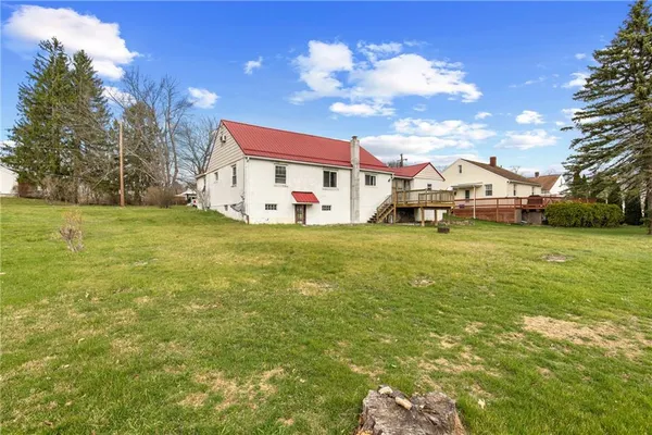 a view of a house with a big yard