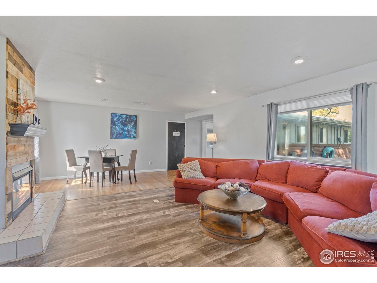 4919 23rd Street Road Greeley, CO 80634 - Photo 4 of 29 Beautiful family room addition with a fireplace and sliders to the deck
