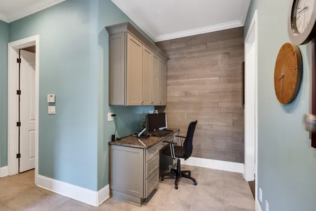 a kitchen with granite countertop a sink stove and cabinets