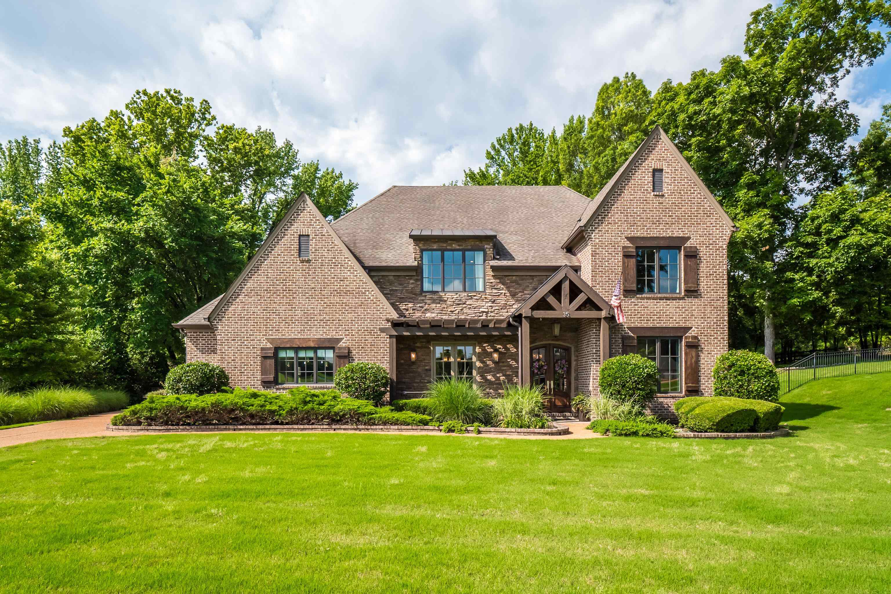 35 Spruce Valley Lane Piperton, TN 38017 - Photo 2 of 39 a front view of a house with a yard and garage